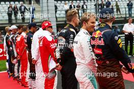 Nico Rosberg (GER) Mercedes AMG F1 with Max Verstappen (NLD) Red Bull Racing as the grid observes the national anthem. 03.07.2016. Formula 1 World Championship, Rd 9, Austrian Grand Prix, Spielberg, Austria, Race Day.