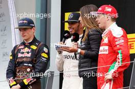 The podium (L to R): Max Verstappen (NLD) Red Bull Racing, second; Lewis Hamilton (GBR) Mercedes AMG F1, race winner; Noemi de Miguel (ESP) TV Presenter; Kimi Raikkonen (FIN) Ferrari, third. 03.07.2016. Formula 1 World Championship, Rd 9, Austrian Grand Prix, Spielberg, Austria, Race Day.