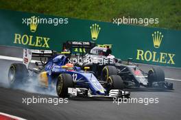 Felipe Nasr (BRA) Sauber C35 and Jenson Button (GBR) McLaren MP4-31 battle for position. 03.07.2016. Formula 1 World Championship, Rd 9, Austrian Grand Prix, Spielberg, Austria, Race Day.