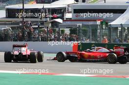 Sebastian Vettel (GER) Ferrari SF16-H spins alongside team mate Kimi Raikkonen (FIN) Ferrari SF16-H at the start of the race. 28.08.2016. Formula 1 World Championship, Rd 13, Belgian Grand Prix, Spa Francorchamps, Belgium, Race Day.