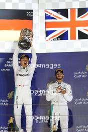 Race winner Nico Rosberg (GER) Mercedes AMG F1 celebrates on the podium alongside third placed team mate Lewis Hamilton (GBR) Mercedes AMG F1. 03.04.2016. Formula 1 World Championship, Rd 2, Bahrain Grand Prix, Sakhir, Bahrain, Race Day.