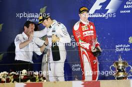 Race winner Nico Rosberg (GER) Mercedes AMG F1 celebrates on the podium with Aldo Costa (ITA) Mercedes AMG F1 Engineering Director and Kimi Raikkonen (FIN) Ferrari (Right). 03.04.2016. Formula 1 World Championship, Rd 2, Bahrain Grand Prix, Sakhir, Bahrain, Race Day.