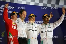 The podium (L to R): Kimi Raikkonen (FIN) Ferrari, second; Aldo Costa (ITA) Mercedes AMG F1 Engineering Director; Nico Rosberg (GER) Mercedes AMG F1, race winner; Lewis Hamilton (GBR) Mercedes AMG F1, third. 03.04.2016. Formula 1 World Championship, Rd 2, Bahrain Grand Prix, Sakhir, Bahrain, Race Day.