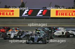 Nico Rosberg (GER) Mercedes AMG F1 W07 Hybrid leads at the start of the race as Lewis Hamilton (GBR) Mercedes AMG F1 W07 Hybrid and Valtteri Bottas (FIN) Williams FW38 make contact. 03.04.2016. Formula 1 World Championship, Rd 2, Bahrain Grand Prix, Sakhir, Bahrain, Race Day.