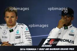 (L to R): Nico Rosberg (GER) Mercedes AMG F1 with team mate Lewis Hamilton (GBR) Mercedes AMG F1 in the FIA Press Conference. 02.04.2016. Formula 1 World Championship, Rd 2, Bahrain Grand Prix, Sakhir, Bahrain, Qualifying Day.
