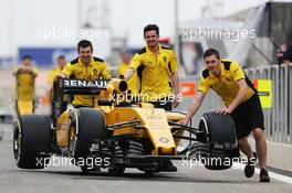 The Renault Sport F1 Team RS16 is pushed down the pitlane. 31.03.2016. Formula 1 World Championship, Rd 2, Bahrain Grand Prix, Sakhir, Bahrain, Preparation Day.