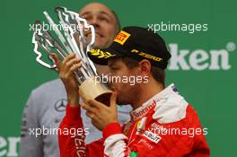 Sebastian Vettel (GER) Ferrari celebrates his second position on the podium. 12.06.2016. Formula 1 World Championship, Rd 7, Canadian Grand Prix, Montreal, Canada, Race Day.