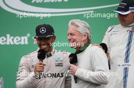 Race winner Lewis Hamilton (GBR) Mercedes AMG F1 celebrates on the podium with Michael Douglas (USA) Actor. 12.06.2016. Formula 1 World Championship, Rd 7, Canadian Grand Prix, Montreal, Canada, Race Day.