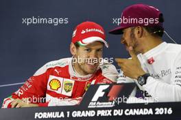 (L to R): Sebastian Vettel (GER) Ferrari and Lewis Hamilton (GBR) Mercedes AMG F1 in the FIA Press Conference. 12.06.2016. Formula 1 World Championship, Rd 7, Canadian Grand Prix, Montreal, Canada, Race Day.