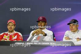 (L to R): Sebastian Vettel (GER) Ferrari; Lewis Hamilton (GBR) Mercedes AMG F1; and Valtteri Bottas (FIN) Williams in the FIA Press Conference. 12.06.2016. Formula 1 World Championship, Rd 7, Canadian Grand Prix, Montreal, Canada, Race Day.