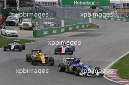 Marcus Ericsson (SWE) Sauber C35 leads Kevin Magnussen (DEN) Renault Sport F1 Team RS16 and Lewis Hamilton (GBR) Mercedes AMG F1 W07 Hybrid. 12.06.2016. Formula 1 World Championship, Rd 7, Canadian Grand Prix, Montreal, Canada, Race Day.
