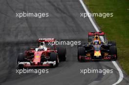 (L to R): Sebastian Vettel (GER) Ferrari SF16-H and Daniel Ricciardo (AUS) Red Bull Racing RB12 battle for position. 12.06.2016. Formula 1 World Championship, Rd 7, Canadian Grand Prix, Montreal, Canada, Race Day.