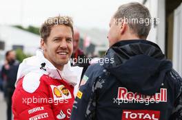 (L to R): Sebastian Vettel (GER) Ferrari with Paul Monaghan (GBR) Red Bull Racing Chief Engineer. 09.06.2016. Formula 1 World Championship, Rd 7, Canadian Grand Prix, Montreal, Canada, Preparation Day.