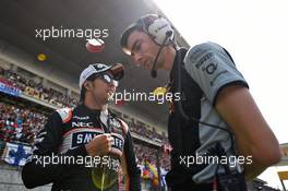 (L to R): Sergio Perez (MEX) Sahara Force India F1 with Tim Wright (GBR) Sahara Force India F1 Team Race Engineer on the grid. 17.04.2016. Formula 1 World Championship, Rd 3, Chinese Grand Prix, Shanghai, China, Race Day.