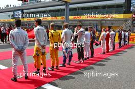 The drivers as the grid observes the national anthem. 17.04.2016. Formula 1 World Championship, Rd 3, Chinese Grand Prix, Shanghai, China, Race Day.