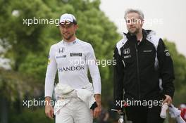 (L to R): Jenson Button (GBR) McLaren with Adam Cooper (GBR) McLaren Press Officer. 16.04.2016. Formula 1 World Championship, Rd 3, Chinese Grand Prix, Shanghai, China, Qualifying Day.