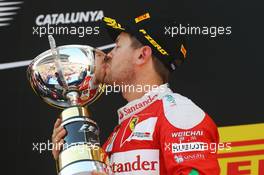Sebastian Vettel (GER) Ferrari celebrates his third position on the podium. 15.05.2016. Formula 1 World Championship, Rd 5, Spanish Grand Prix, Barcelona, Spain, Race Day.