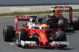 Sebastian Vettel (GER) Ferrari SF16-H leads Daniel Ricciardo (AUS) Red Bull Racing RB12. 15.05.2016. Formula 1 World Championship, Rd 5, Spanish Grand Prix, Barcelona, Spain, Race Day.