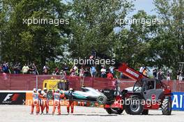 The Mercedes AMG F1 W07 Hybrid of race retiree Nico Rosberg (GER) Mercedes AMG F1 is craned away from the gravel trap at the start of the race. 15.05.2016. Formula 1 World Championship, Rd 5, Spanish Grand Prix, Barcelona, Spain, Race Day.