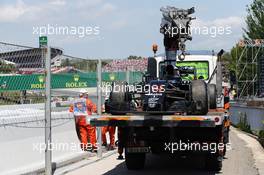 The McLaren MP4-31 of race retiree Fernando Alonso (ESP) McLaren is recovered back to the pits on the back of a truck. 15.05.2016. Formula 1 World Championship, Rd 5, Spanish Grand Prix, Barcelona, Spain, Race Day.