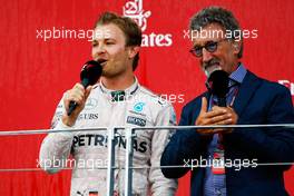 (L to R): Race winner Nico Rosberg (GER) Mercedes AMG F1 on the podium. with Eddie Jordan (IRE). 19.06.2016. Formula 1 World Championship, Rd 8, European Grand Prix, Baku Street Circuit, Azerbaijan, Race Day.