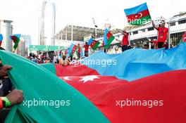 Fans with the Azerbaijan flag at the podium. 19.06.2016. Formula 1 World Championship, Rd 8, European Grand Prix, Baku Street Circuit, Azerbaijan, Race Day.