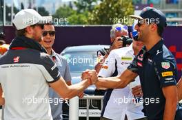 (L to R): Romain Grosjean (FRA) Haas F1 Team and Daniel Ricciardo (AUS) Red Bull Racing on the drivers parade. 19.06.2016. Formula 1 World Championship, Rd 8, European Grand Prix, Baku Street Circuit, Azerbaijan, Race Day.