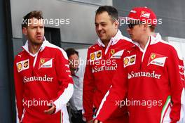 (L to R): Sebastian Vettel (GER) Ferrari with Diego Ioverno (ITA) Ferrari Operations Director and Kimi Raikkonen (FIN) Ferrari. 08.07.2016. Formula 1 World Championship, Rd 10, British Grand Prix, Silverstone, England, Practice Day.