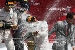 Race winner Lewis Hamilton (GBR) Mercedes AMG F1 celebrates with the champagne on the podium. 10.07.2016. Formula 1 World Championship, Rd 10, British Grand Prix, Silverstone, England, Race Day.