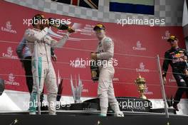 Race winner Lewis Hamilton (GBR) Mercedes AMG F1 celebrates on the podium with team mate Nico Rosberg (GER) Mercedes AMG F1. 10.07.2016. Formula 1 World Championship, Rd 10, British Grand Prix, Silverstone, England, Race Day.