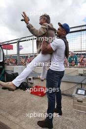 Anthony Joshua (GBR) Boxer with Eddie Jordan (IRE). 10.07.2016. Formula 1 World Championship, Rd 10, British Grand Prix, Silverstone, England, Race Day.