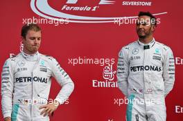(L to R): Nico Rosberg (GER) Mercedes AMG F1 on the podium with team mate Lewis Hamilton (GBR) Mercedes AMG F1. 10.07.2016. Formula 1 World Championship, Rd 10, British Grand Prix, Silverstone, England, Race Day.
