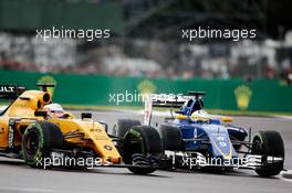 (L to R): Kevin Magnussen (DEN) Renault Sport F1 Team RS16 and Marcus Ericsson (SWE) Sauber C35 battle for position. 10.07.2016. Formula 1 World Championship, Rd 10, British Grand Prix, Silverstone, England, Race Day.