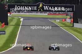 Max Verstappen (NLD) Red Bull Racing RB12 and Nico Rosberg (GER) Mercedes AMG F1 W07 Hybrid battle for position. 10.07.2016. Formula 1 World Championship, Rd 10, British Grand Prix, Silverstone, England, Race Day.