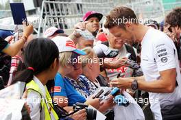 Jenson Button (GBR) McLaren signs autographs for the fans. 07.07.2016. Formula 1 World Championship, Rd 10, British Grand Prix, Silverstone, England, Preparation Day.