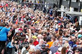 Fans in the pit lane. 07.07.2016. Formula 1 World Championship, Rd 10, British Grand Prix, Silverstone, England, Preparation Day.