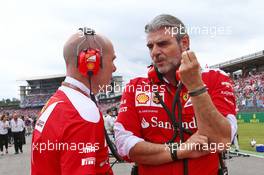 (L to R): Jock Clear (GBR) Ferrari Engineering Director with Maurizio Arrivabene (ITA) Ferrari Team Principal on the grid. 31.07.2016. Formula 1 World Championship, Rd 12, German Grand Prix, Hockenheim, Germany, Race Day.