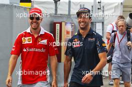 (L to R): Sebastian Vettel (GER) Ferrari with Daniel Ricciardo (AUS) Red Bull Racing. 28.07.2016. Formula 1 World Championship, Rd 12, German Grand Prix, Hockenheim, Germany, Preparation Day.