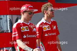 (L to R): Kimi Raikkonen (FIN) Ferrari with team mate Sebastian Vettel (GER) Ferrari. 22.07.2016. Formula 1 World Championship, Rd 11, Hungarian Grand Prix, Budapest, Hungary, Practice Day.