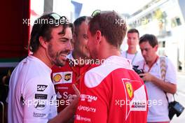 Fernando Alonso (ESP), McLaren Honda and Sebastian Vettel (GER), Scuderia Ferrari  22.07.2016. Formula 1 World Championship, Rd 11, Hungarian Grand Prix, Budapest, Hungary, Practice Day.