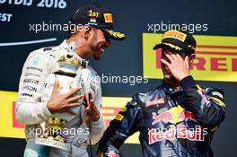 (L to R): race winner Lewis Hamilton (GBR) Mercedes AMG F1 celebrates on the podium with third placed Daniel Ricciardo (AUS) Red Bull Racing. 24.07.2016. Formula 1 World Championship, Rd 11, Hungarian Grand Prix, Budapest, Hungary, Race Day.