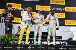 The podium (L to R): Daniel Ricciardo (AUS) Red Bull Racing; Kai Ebel (GER) RTL TV Presenter; Nico Rosberg (GER) Mercedes AMG F1; Lewis Hamilton (GBR) Mercedes AMG F1. 24.07.2016. Formula 1 World Championship, Rd 11, Hungarian Grand Prix, Budapest, Hungary, Race Day.