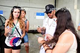 Lewis Hamilton (GBR) Mercedes AMG F1 signs autographs for the fans. 24.07.2016. Formula 1 World Championship, Rd 11, Hungarian Grand Prix, Budapest, Hungary, Race Day.