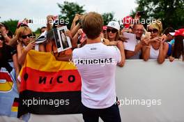Nico Rosberg (GER) Mercedes AMG F1 signs autographs for the fans. 24.07.2016. Formula 1 World Championship, Rd 11, Hungarian Grand Prix, Budapest, Hungary, Race Day.
