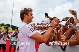 Nico Rosberg (GER) Mercedes AMG F1 signs autographs for the fans. 24.07.2016. Formula 1 World Championship, Rd 11, Hungarian Grand Prix, Budapest, Hungary, Race Day.