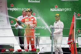 (L to R): Sebastian Vettel (GER) Ferrari celebrates on the podium with Lewis Hamilton (GBR) Mercedes AMG F1. 04.09.2016. Formula 1 World Championship, Rd 14, Italian Grand Prix, Monza, Italy, Race Day.