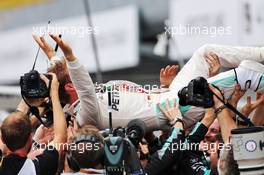 Race winner Nico Rosberg (GER) Mercedes AMG F1 celebrates with the team in parc ferme. 04.09.2016. Formula 1 World Championship, Rd 14, Italian Grand Prix, Monza, Italy, Race Day.
