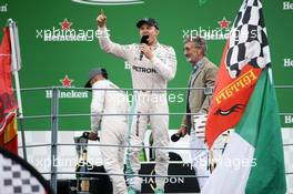 Race winner Nico Rosberg (GER) Mercedes AMG F1 on the podium with Eddie Jordan (IRE). 04.09.2016. Formula 1 World Championship, Rd 14, Italian Grand Prix, Monza, Italy, Race Day.