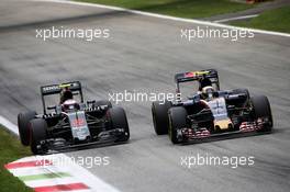 (L to R): Jenson Button (GBR) McLaren and Carlos Sainz Jr (ESP) Scuderia Toro Rosso STR11 battle for position. 04.09.2016. Formula 1 World Championship, Rd 14, Italian Grand Prix, Monza, Italy, Race Day.