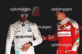 (L to R): Pole sitter Lewis Hamilton (GBR) Mercedes AMG F1 with third placed Sebastian Vettel (GER) Ferrari in parc ferme. 03.09.2016. Formula 1 World Championship, Rd 14, Italian Grand Prix, Monza, Italy, Qualifying Day.